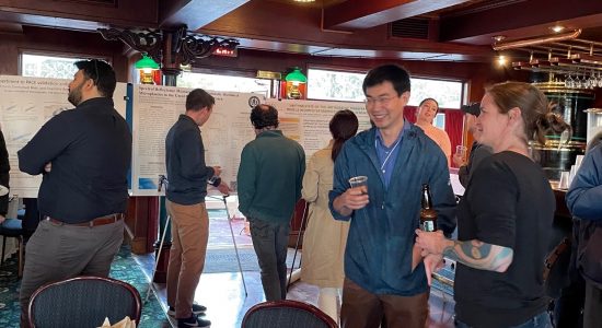 People mingling at a luncheon event aboard a riverboat at the NASA PACE conference