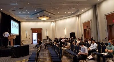 FGM2022 Conference attendees are seated and viewing a presentation in a Hartford Marriott Downtown meeting space