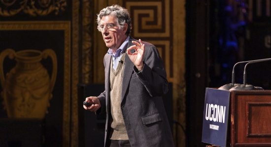 Richard Davidson on stage speaking to the Palace Theater audience at the 2023 WISH Fest