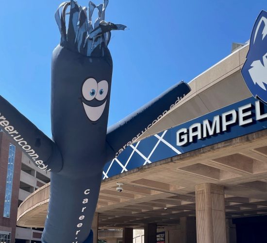 Gampel pavilion exterior with fan man