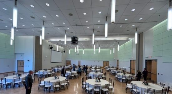 Student Union Ballroom set up with tables and chairs before a banquet