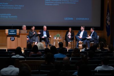 Panel of experts on seated on stage