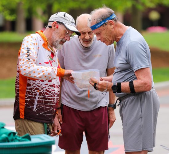 group of individuals looking at a map