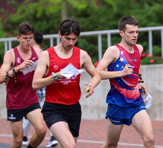 Three runners participating in an orienteering competition